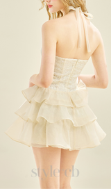 HALTER RUFFLE TRIM MINI DRESS IN APRICOT