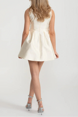 Elegant Fitted Dress With Pearl-Embellished Round Neckline And Bow Waistline Accent - Ivoire