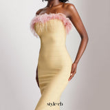 yellow midi bandage dress with off-shoulder feather embellishments