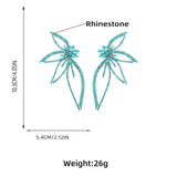 CRYSTAL FLOWER EARRINGS IN BLUE Earrings styleofcb