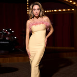 yellow midi bandage dress with off-shoulder feather embellishments