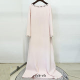 blush pink long sleeve kaftan-style maxi dress