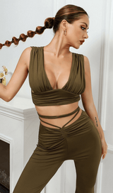 Open-back top and high-waisted bootcut trousers.
